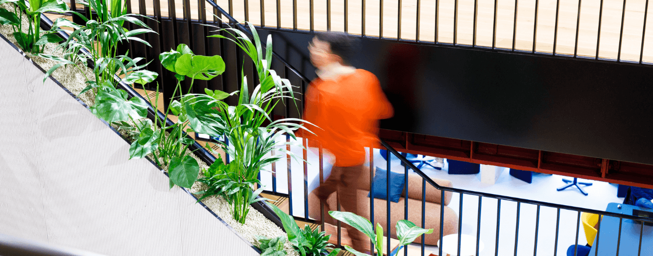 A colleague running up the stairs